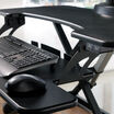 close up view of the keyboard tray of an electric desk converter