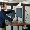 studio lamp being adjusted to use when on a conference call in an open workspace