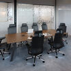 executive conference table in walnut finish setup in a workspace