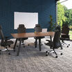 executive conference table in walnut finish setup in a workspace
