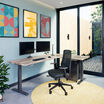 reclaimed wood finish l shape electric standing desk in an office workspace
