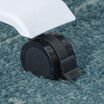 close up of caster on an electric standing desk on carpet