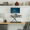 VariDesk Essential Vertical Lift 30 front view in a home office setting.