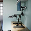 Side view of the Varidesk Essential Vertical Lift 30 in raised position.